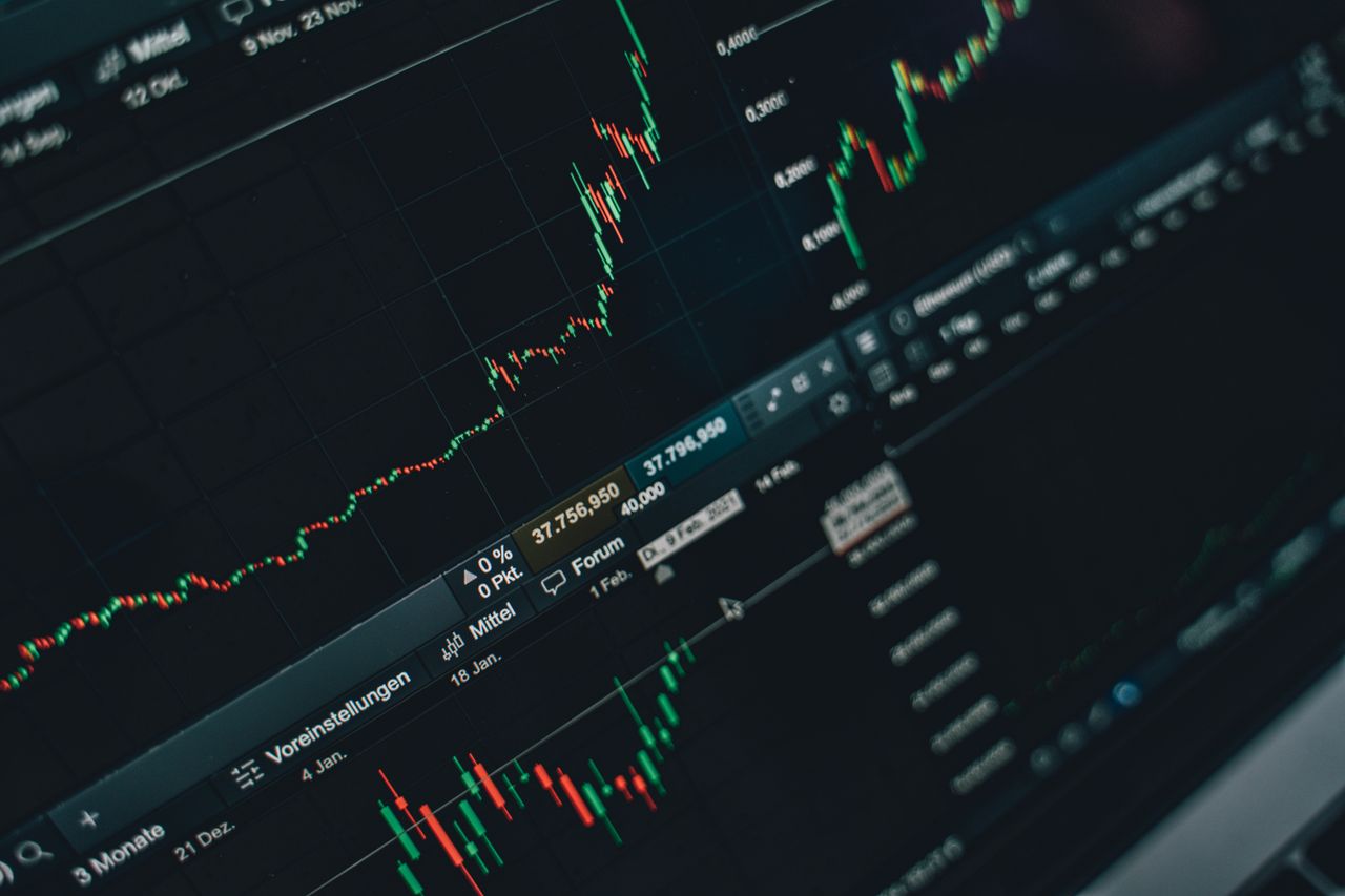 home-hero-bg Close-up of stock market trading screen displaying financial growth and charts.