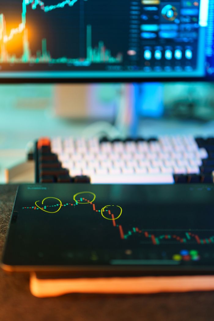home-services-01 Visual of cryptocurrency trading screens displaying market analysis and candlestick charts.